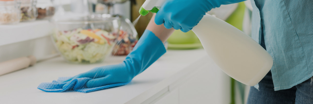 Cleaning a table with a spray