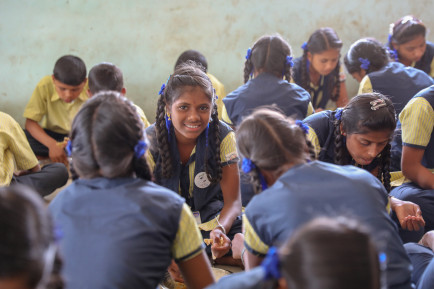 Pupils sitting on the ground