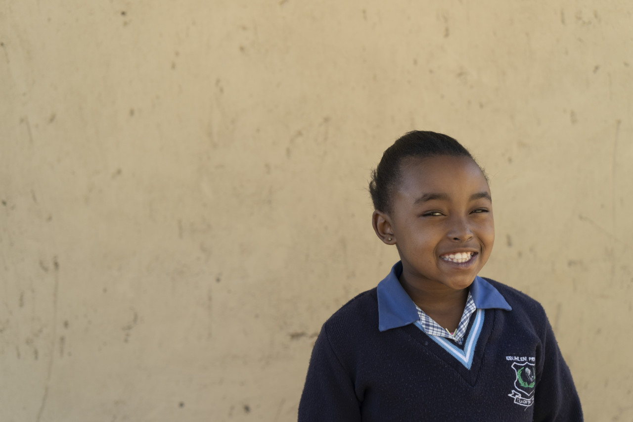 A child smiling at the camera